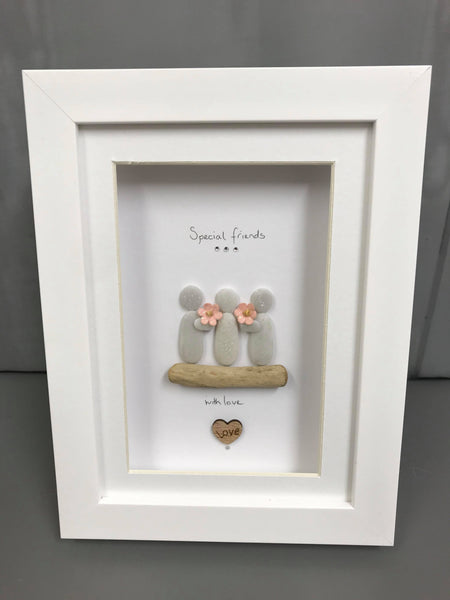 Special Friends design, 2 pebble people holding a flower